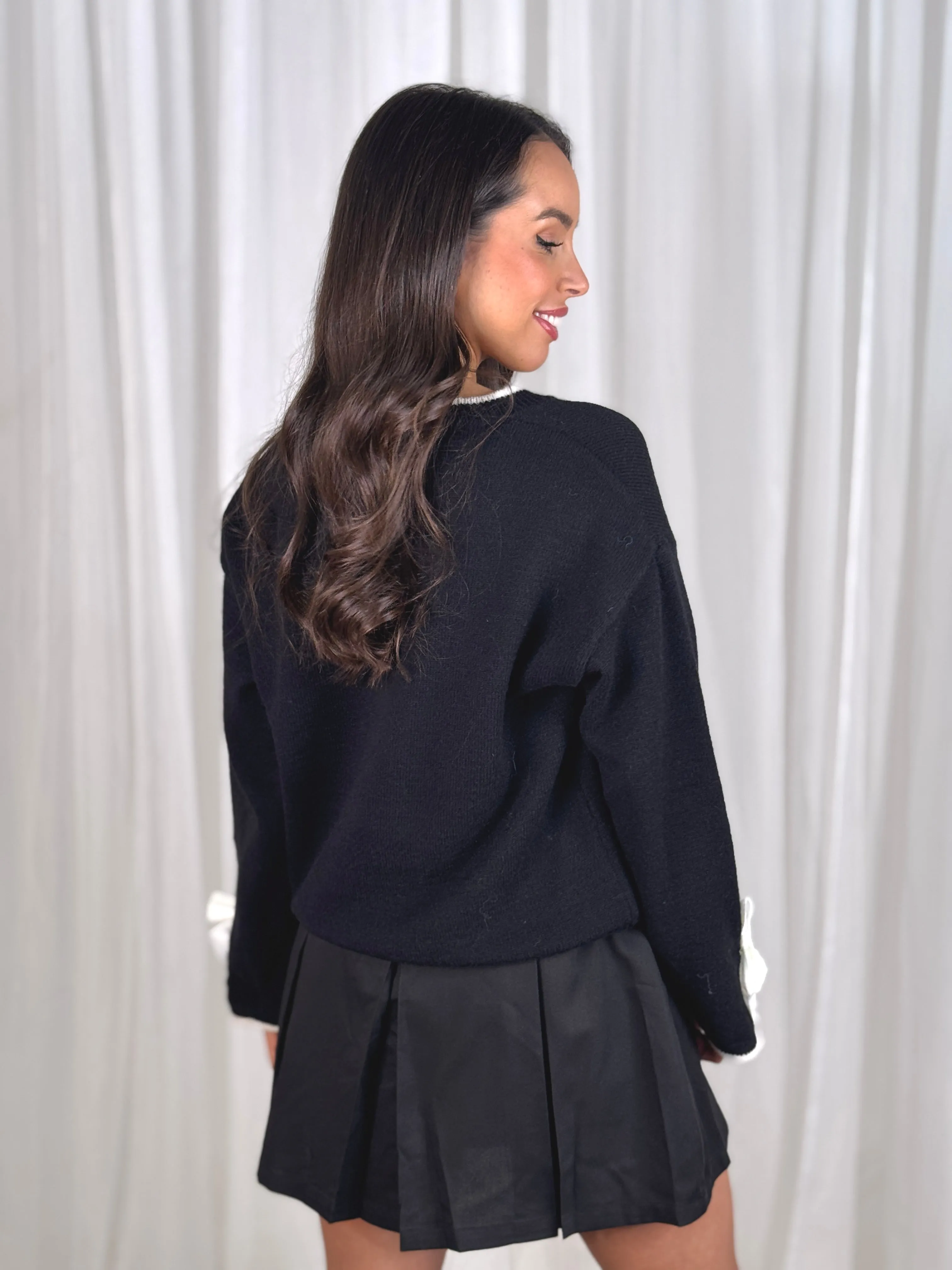 Kendra Bow Cuff Jumper In Black